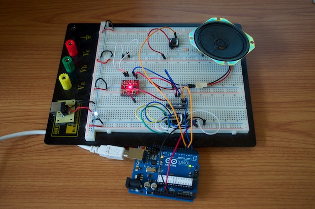 SpeakJet Arduino prototype on a breadboard with an Arduino board and speaker.